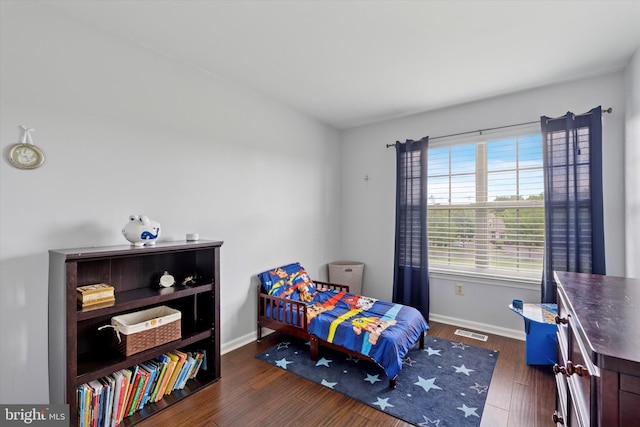 2405 Carriage Ln, Royersford, PA 19468 - bedroom featuring baseboards and dark wood-style flooring