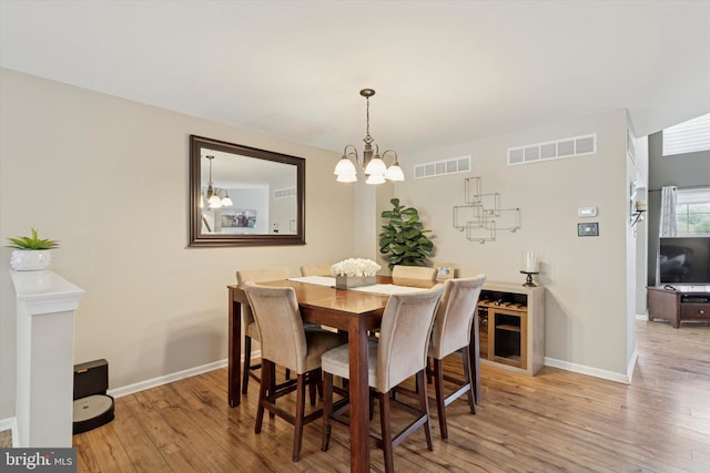 2405 Carriage Ln, Royersford, PA 19468 - dining room with wood finished floors and a chandelier