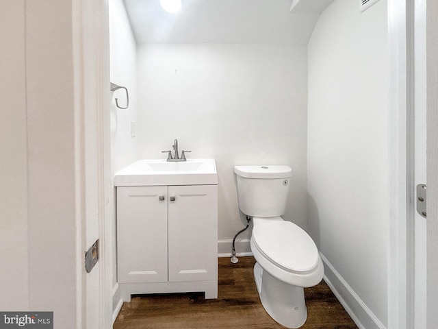 2217 Riggs Ave, Baltimore, MD 21216 - half bath with wood finished floors and vanity