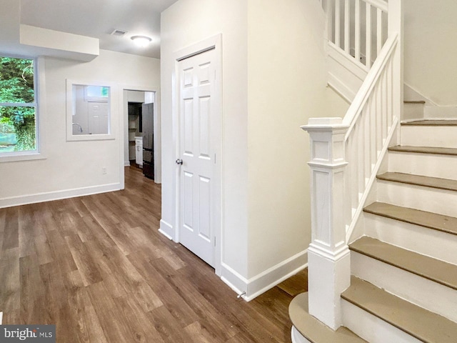 2217 Riggs Ave, Baltimore, MD 21216 - staircase featuring wood finished floors and baseboards