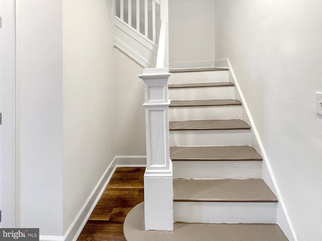 2217 Riggs Ave, Baltimore, MD 21216 - staircase featuring baseboards and wood finished floors