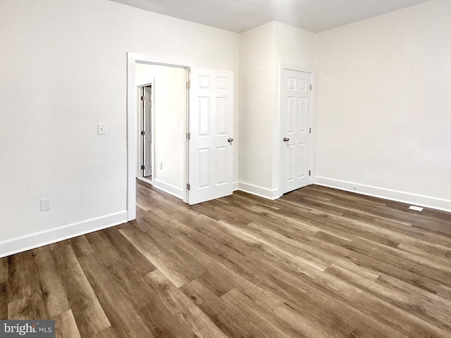 2217 Riggs Ave, Baltimore, MD 21216 - unfurnished bedroom with wood finished floors and baseboards