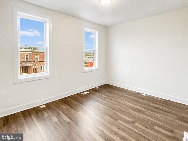 2217 Riggs Ave, Baltimore, MD 21216 - unfurnished room with plenty of natural light and wood finished floors