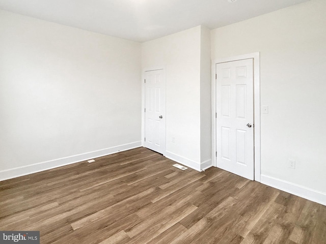 2217 Riggs Ave, Baltimore, MD 21216 - unfurnished bedroom with wood finished floors and baseboards