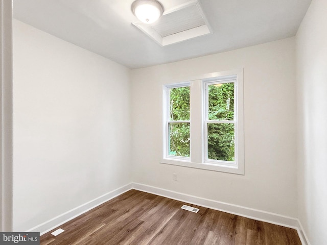 2217 Riggs Ave, Baltimore, MD 21216 - empty room with baseboards and dark wood-style flooring