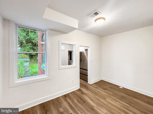 2217 Riggs Ave, Baltimore, MD 21216 - unfurnished room featuring baseboards and wood finished floors
