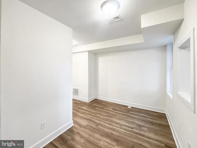 2217 Riggs Ave, Baltimore, MD 21216 - empty room featuring dark wood-style flooring and baseboards