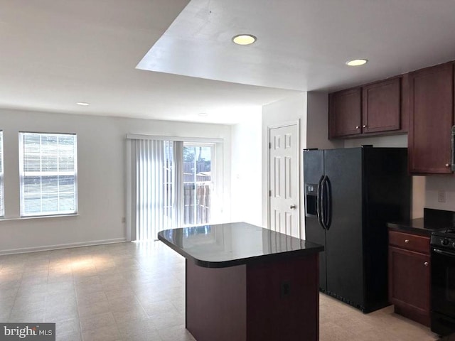 18 Kilgore Way, Bunker Hill, WV 25413 - kitchen with black appliances, dark countertops, recessed lighting, open floor plan, and a center island