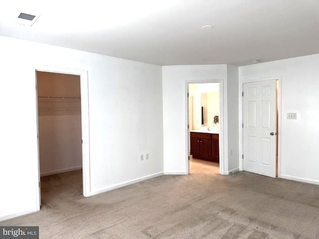 18 Kilgore Way, Bunker Hill, WV 25413 - unfurnished bedroom with light carpet, a spacious closet, a closet, and connected bathroom