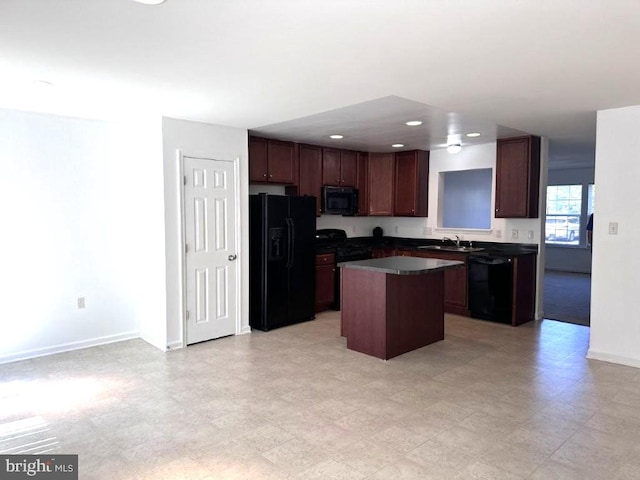 18 Kilgore Way, Bunker Hill, WV 25413 - kitchen with black appliances, a kitchen island, dark countertops, recessed lighting, and light floors