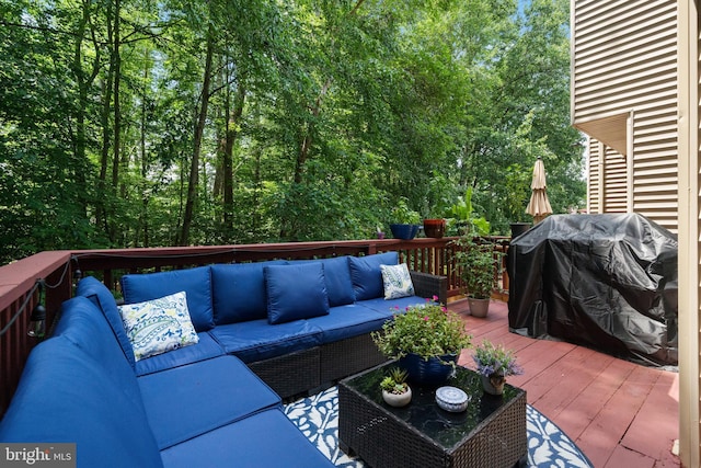 11590 Mohican Rd, Woodbridge, VA 22192 - wooden terrace with an outdoor living space and area for grilling