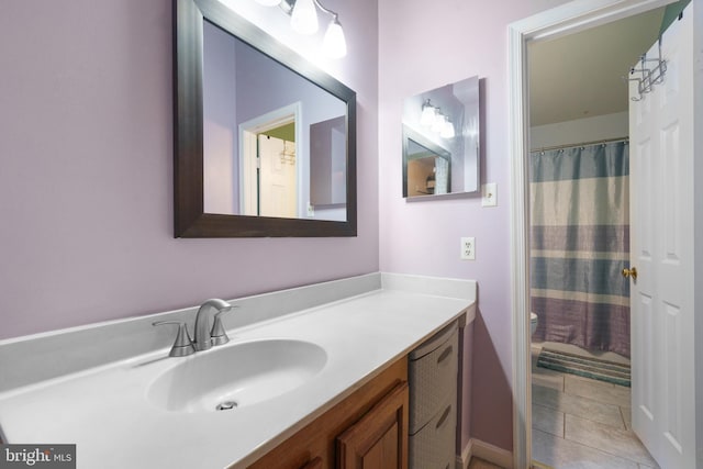 11590 Mohican Rd, Woodbridge, VA 22192 - full bathroom with vanity, a shower with curtain, and tile patterned flooring