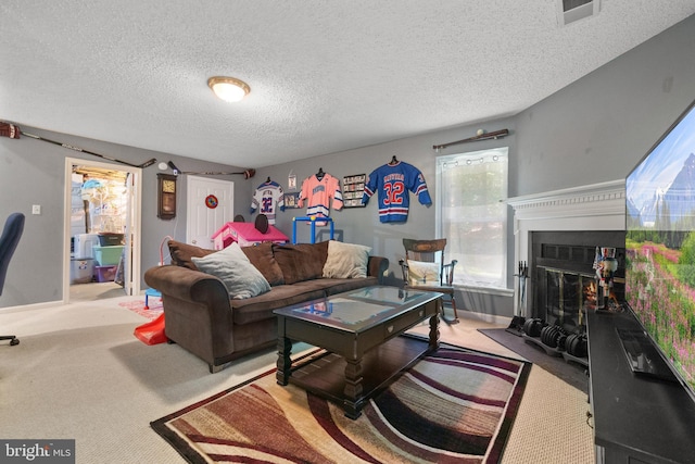 11590 Mohican Rd, Woodbridge, VA 22192 - living room featuring carpet, a textured ceiling, and a fireplace with flush hearth
