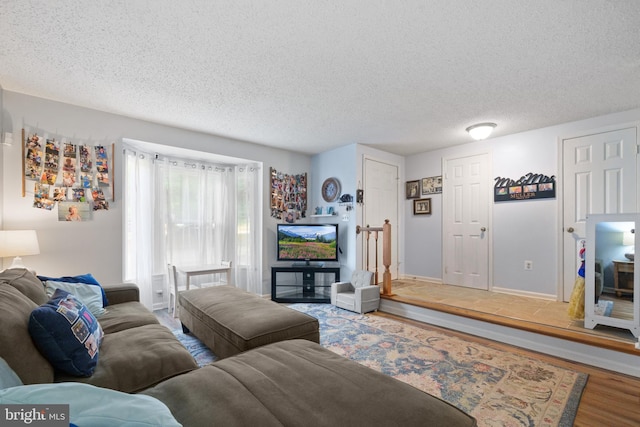 11590 Mohican Rd, Woodbridge, VA 22192 - living room featuring wood finished floors and a textured ceiling