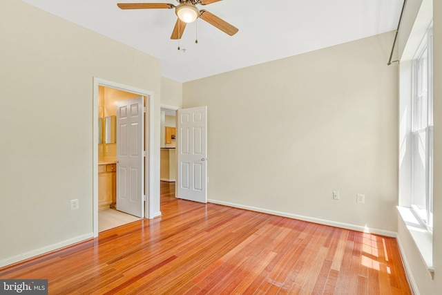 13329 Connor Dr Unit G, Centreville, VA 20120 - unfurnished bedroom featuring light wood finished floors, ensuite bathroom, and a ceiling fan