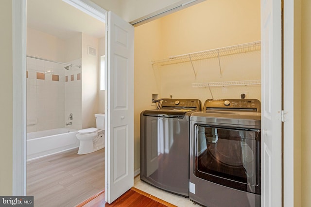 13329 Connor Dr Unit G, Centreville, VA 20120 - laundry area with washer and clothes dryer and wood finished floors