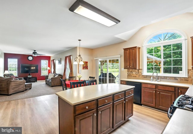 126 Fairbrook Dr, Gilbertsville, PA 19525 - kitchen featuring black appliances, light countertops, light wood finished floors, and lofted ceiling