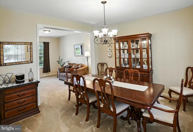 126 Fairbrook Dr, Gilbertsville, PA 19525 - dining space with light colored carpet and a chandelier