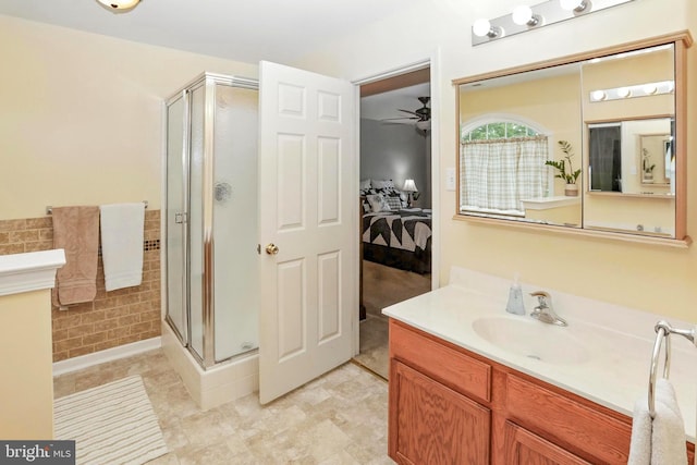 126 Fairbrook Dr, Gilbertsville, PA 19525 - ensuite bathroom with a stall shower, ceiling fan, vanity, and tile walls