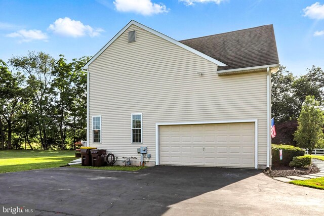 126 Fairbrook Dr, Gilbertsville, PA 19525 - view of side of property with asphalt driveway, a shingled roof, and an attached garage