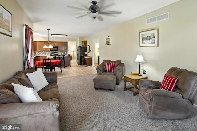 126 Fairbrook Dr, Gilbertsville, PA 19525 - living area with a ceiling fan, a chandelier, and light wood finished floors