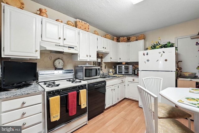 3701 George Mason Dr S Unit 1803N, Falls Church, VA 22041 - kitchen with white appliances, under cabinet range hood, light wood-style floors, white cabinetry, and a textured ceiling