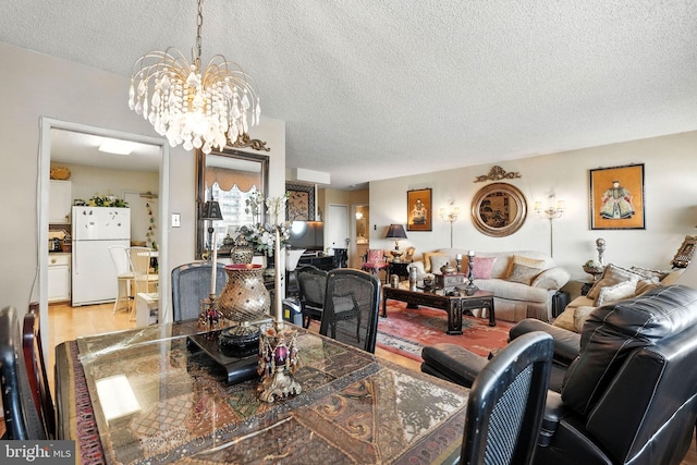 3701 George Mason Dr S Unit 1803N, Falls Church, VA 22041 - dining space with a textured ceiling, a chandelier, and light wood-type flooring