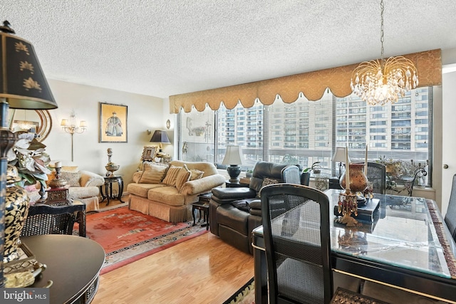 3701 George Mason Dr S Unit 1803N, Falls Church, VA 22041 - living room featuring a textured ceiling, a chandelier, wood finished floors, and healthy amount of natural light