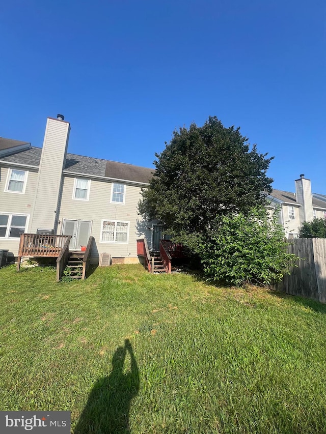 613 Buttonwoods Rd, Elkton, MD 21921 - rear view of property featuring a deck and a chimney