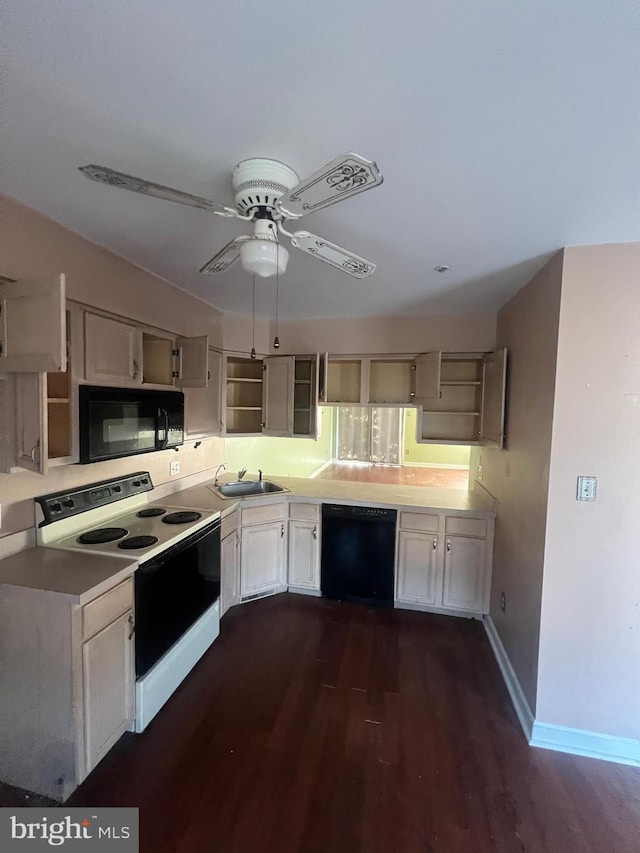 613 Buttonwoods Rd, Elkton, MD 21921 - kitchen featuring black appliances, dark wood finished floors, ceiling fan, and light countertops
