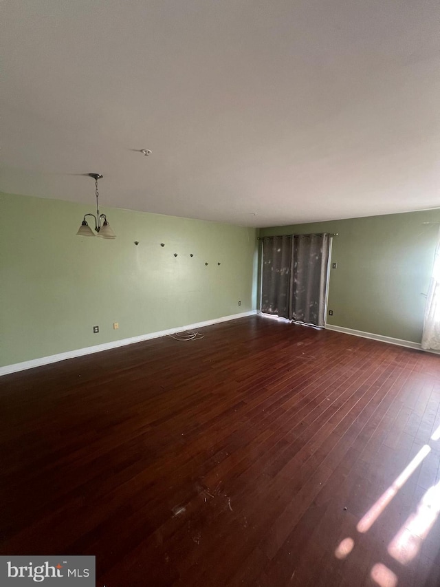 613 Buttonwoods Rd, Elkton, MD 21921 - unfurnished living room with dark wood-type flooring and baseboards
