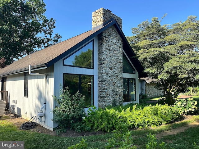 213 Tomahawk Dr, Conestoga, PA 17516 - view of side of property featuring a chimney and stone siding