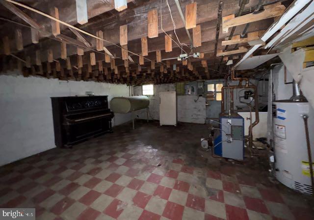 3953 Wilsby Ave, Baltimore, MD 21218 - basement with gas water heater, tile patterned floors, and a heating unit