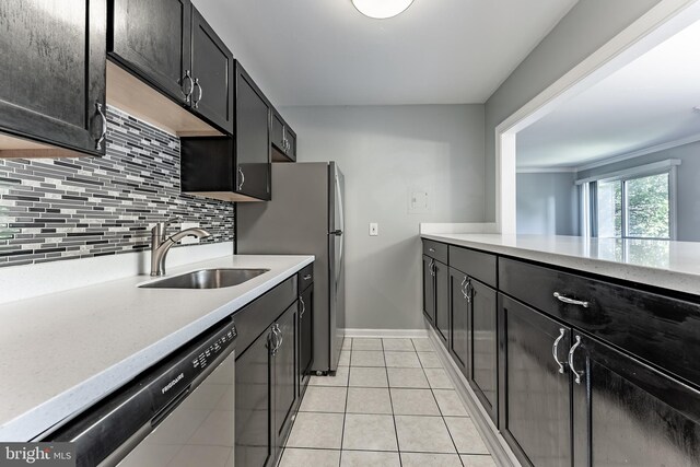 2908 Kings Chapel Rd Unit 03/12, Falls Church, VA 22042 - kitchen with stainless steel appliances, decorative backsplash, light tile patterned floors, and dark cabinets