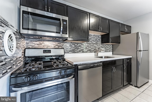 2908 Kings Chapel Rd Unit 03/12, Falls Church, VA 22042 - kitchen with stainless steel appliances, light countertops, light tile patterned flooring, and tasteful backsplash