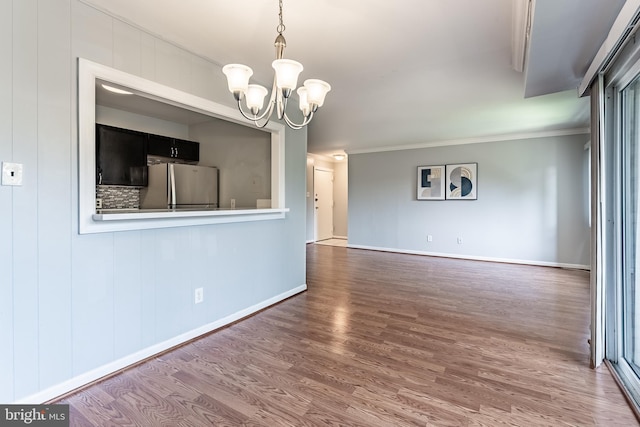 2908 Kings Chapel Rd Unit 03/12, Falls Church, VA 22042 - spare room with wood finished floors, a chandelier, and ornamental molding