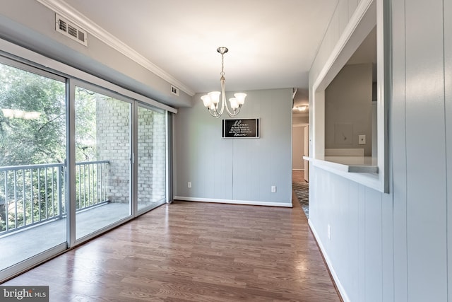 2908 Kings Chapel Rd Unit 03/12, Falls Church, VA 22042 - unfurnished dining area with a chandelier, wood finished floors, and crown molding