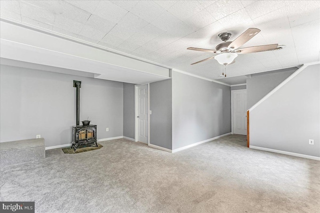 3189 Horseshoe Pike, Honey Brook, PA 19344 - unfurnished living room with a wood stove, carpet flooring, and a ceiling fan