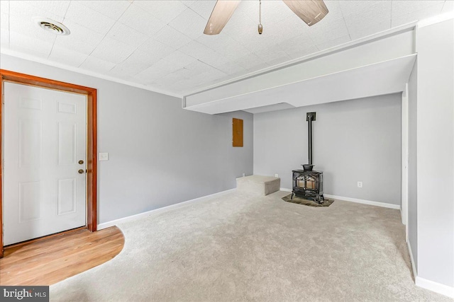 3189 Horseshoe Pike, Honey Brook, PA 19344 - basement with a wood stove, carpet flooring, and ceiling fan