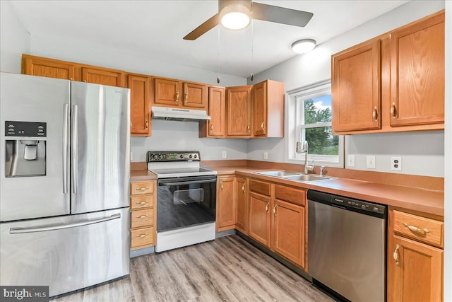 3189 Horseshoe Pike, Honey Brook, PA 19344 - kitchen with appliances with stainless steel finishes, under cabinet range hood, light wood-style floors, a ceiling fan, and light countertops