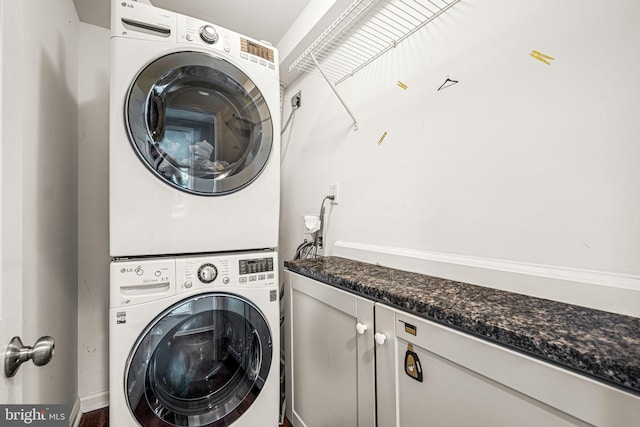 177 Bortondale Rd, Media, PA 19063 - laundry room featuring stacked washer / dryer and cabinet space