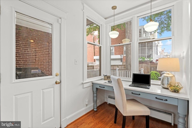 1425 Webster St NW, Washington, DC 20011 - office featuring wood finished floors, built in study area, and a baseboard heating unit
