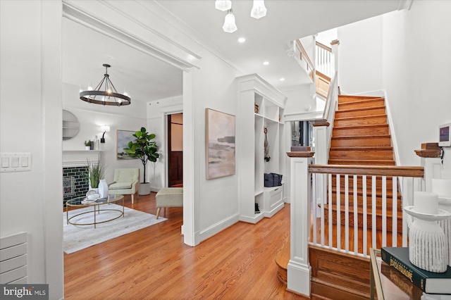1425 Webster St NW, Washington, DC 20011 - hall featuring wood finished floors, stairway, a chandelier, and recessed lighting