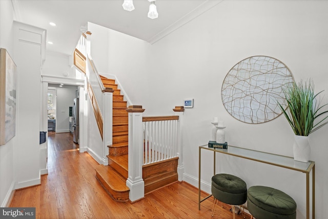 1425 Webster St NW, Washington, DC 20011 - entryway with wood finished floors, stairway, crown molding, and recessed lighting