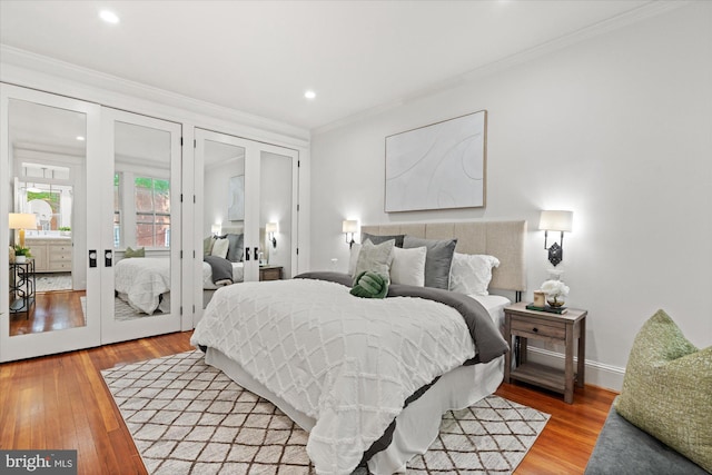 1425 Webster St NW, Washington, DC 20011 - bedroom with crown molding, french doors, light wood-type flooring, and recessed lighting