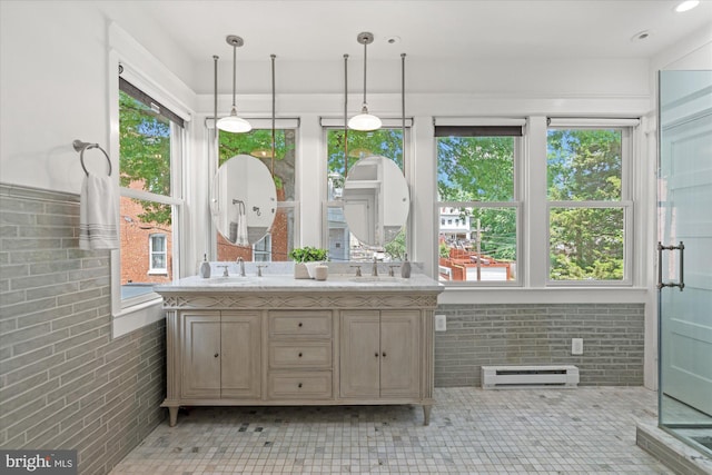 1425 Webster St NW, Washington, DC 20011 - full bath with a baseboard radiator, double vanity, brick wall, and a shower