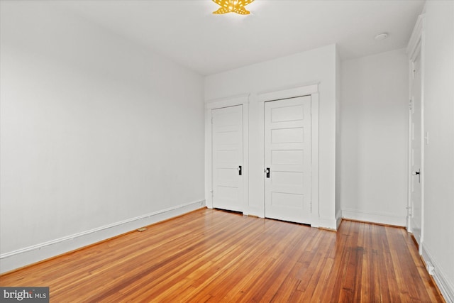 1425 Webster St NW, Washington, DC 20011 - unfurnished bedroom featuring baseboards and light wood-type flooring
