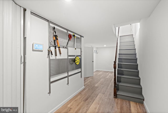 1425 Webster St NW, Washington, DC 20011 - hallway with wood finished floors, stairs, and recessed lighting