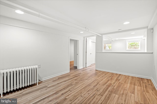 1425 Webster St NW, Washington, DC 20011 - spare room featuring radiator, wood finished floors, and recessed lighting