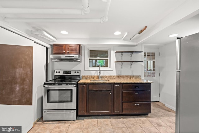1425 Webster St NW, Washington, DC 20011 - kitchen with appliances with stainless steel finishes, under cabinet range hood, light stone countertops, open shelves, and recessed lighting